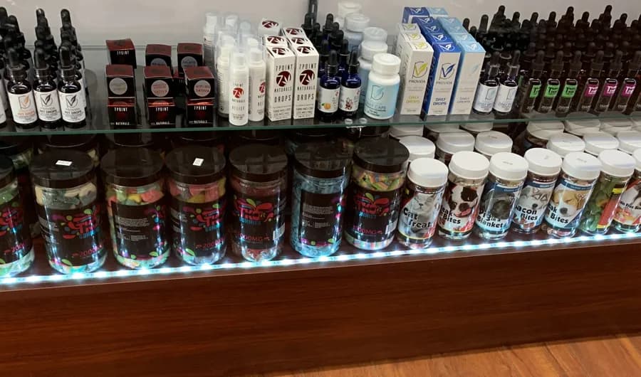 CBD tinctures and gummies in the case at Smoke Valley Plantation